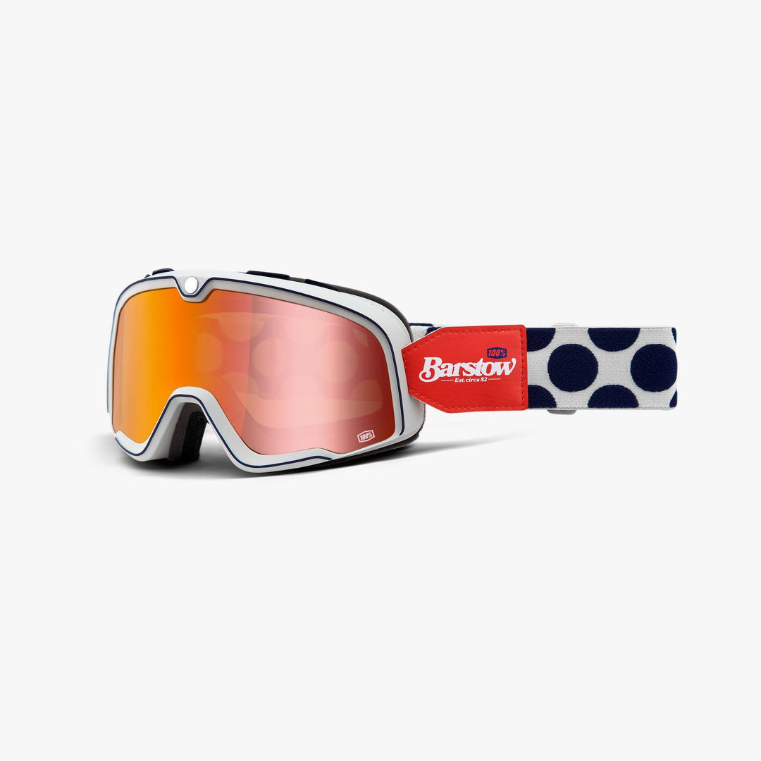 100% Barstow Hayworth Brille mit hellem Rahmen, rot-orange verspiegelter Scheibe und dunkel gepunktetem Band.